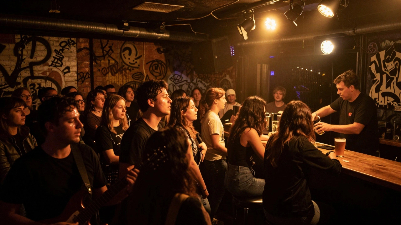 Crowd dancing under dynamic lights at Electric Brixton during a live indie band performance.
