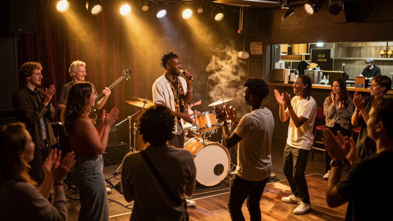 Diverse crowd clapping at a live Afrobeat performance in a warm-lit jazz cafe.