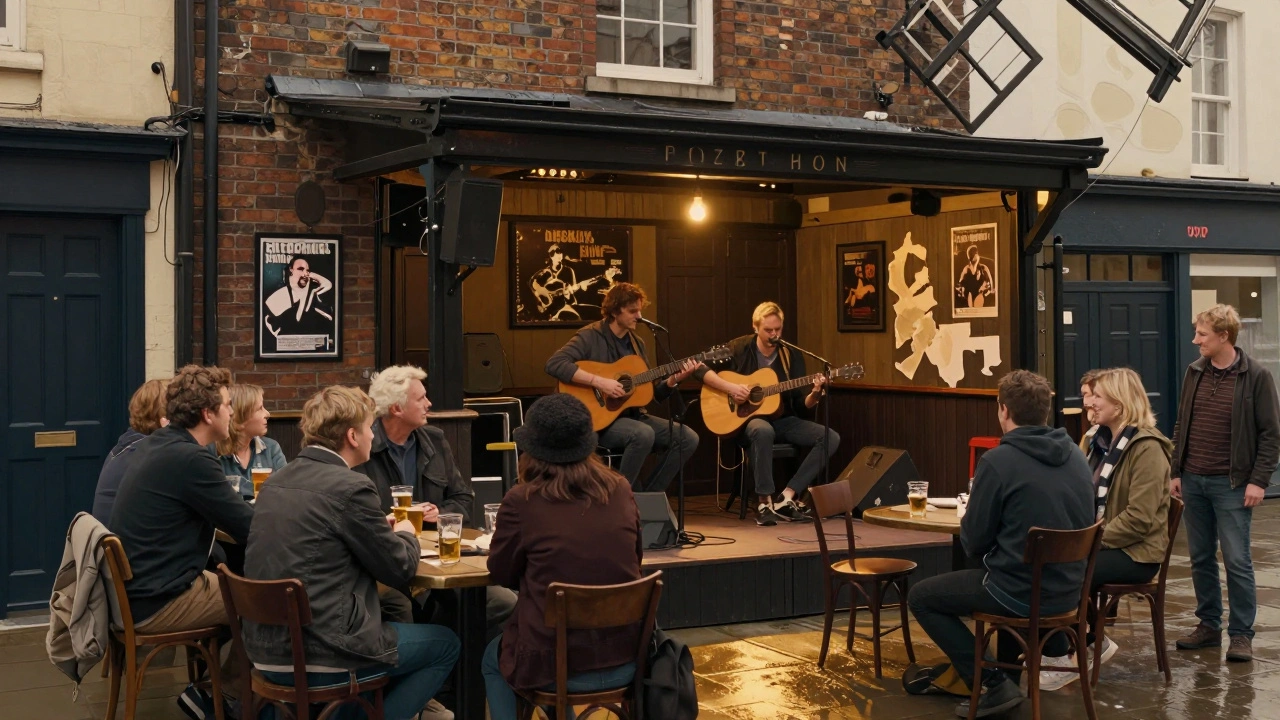 A modest pub stage with an acoustic duo playing under a single bulb, locals leaning in close, posters peeling from the walls.